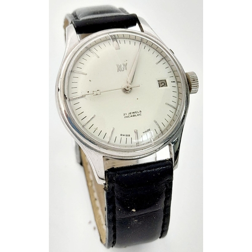 954 - An Early Swiss Made Roy Watch. 35mm case. White dial with date box. Black leather strap (could do wi... 