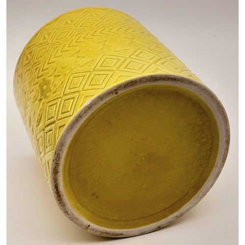 1301 - An Antique Chinese Yellow Ceramic Brush Holder. 10.5cm diameter at lip. 12cm tall.