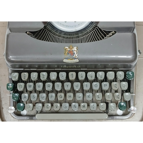 1309 - A vintage 1950's Imperial Good Companion 3 typewriter. Complete with it's outer case. In good condit... 