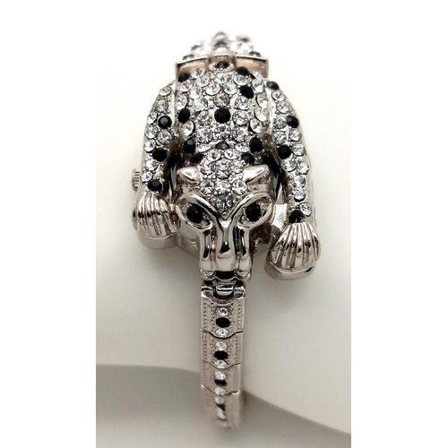 202 - The epitome of glamour and design: a Panther bracelet, studded with cubic zirconia which - when open... 