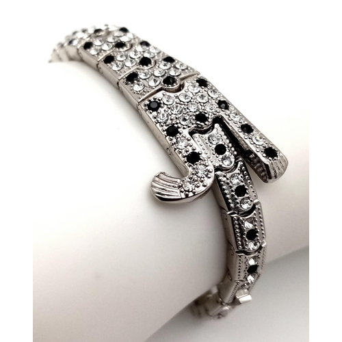 202 - The epitome of glamour and design: a Panther bracelet, studded with cubic zirconia which - when open... 