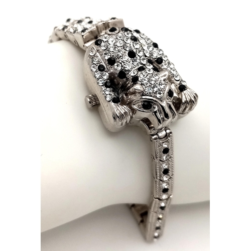 202 - The epitome of glamour and design: a Panther bracelet, studded with cubic zirconia which - when open... 