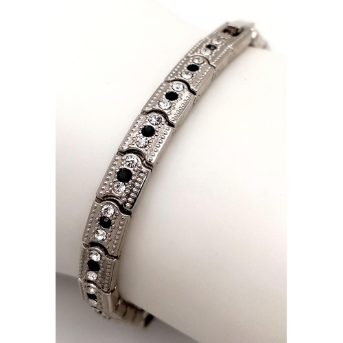 202 - The epitome of glamour and design: a Panther bracelet, studded with cubic zirconia which - when open... 