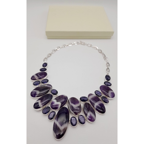 293 - An exquisite white metal (untested) amethyst necklace carrying large cabochons with the rarely seen ... 