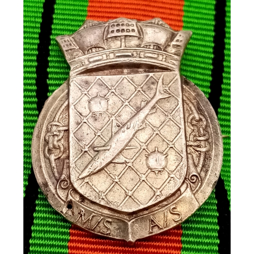 673 - A WW2 British Defence Medal with a Silver Royal Navy Patrol Pin. The pin was normally given to Briti... 