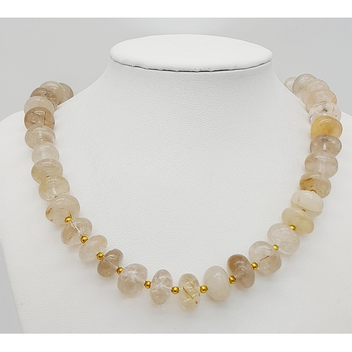 292 - A very rare, totally natural, RUTILATED QUARTZ necklace, bracelet and earrings set. Necklace length:... 