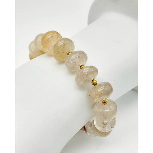 292 - A very rare, totally natural, RUTILATED QUARTZ necklace, bracelet and earrings set. Necklace length:... 