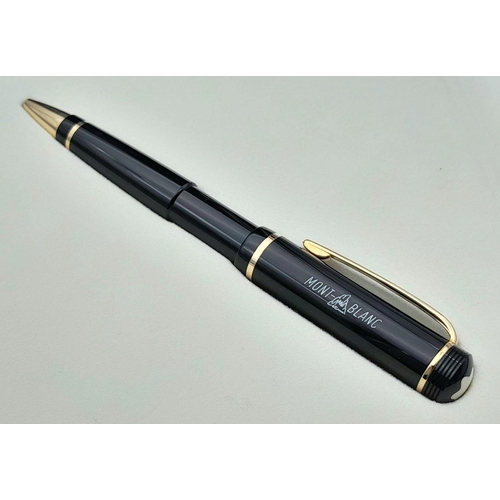 572 - A Montblanc Anniversary Edition Twist Ballpoint Pen - 1906 -2006. Black resin and gilded decoration.... 