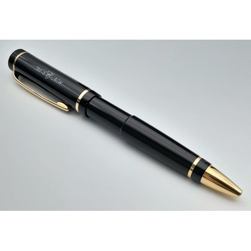 572 - A Montblanc Anniversary Edition Twist Ballpoint Pen - 1906 -2006. Black resin and gilded decoration.... 