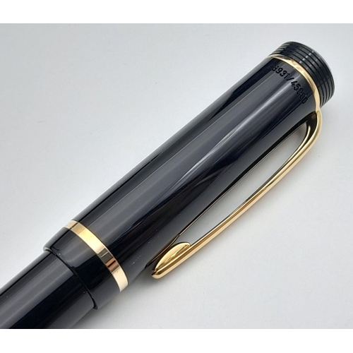 572 - A Montblanc Anniversary Edition Twist Ballpoint Pen - 1906 -2006. Black resin and gilded decoration.... 