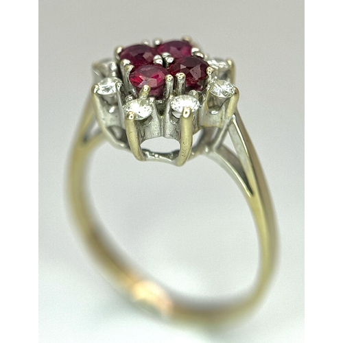 1148 - An 18K Yellow Gold Ruby and Diamond Ring. Brilliant cuts in floral form. 040ctw diamonds. 0.40ctw ru... 