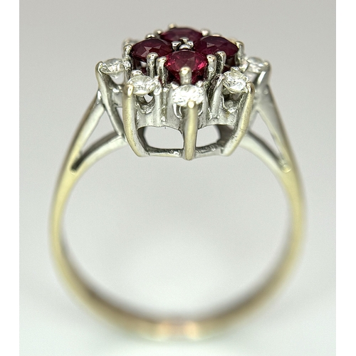 1148 - An 18K Yellow Gold Ruby and Diamond Ring. Brilliant cuts in floral form. 040ctw diamonds. 0.40ctw ru... 