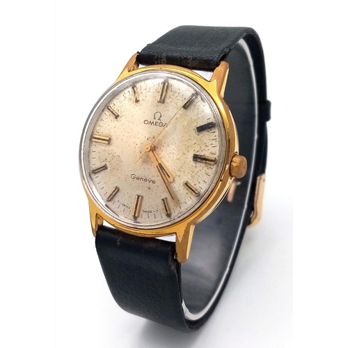 1169 - A Vintage Omega Geneve Mechanical Gents Watch. Black leather strap. Gilded case - 35mm. Hand-wind. P... 