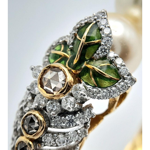 650 - A Stunning, Head-Turning 18K Yellow Gold, Diamond and Pearl Bangle. Serpentine in nature, this eclec... 