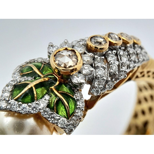 650 - A Stunning, Head-Turning 18K Yellow Gold, Diamond and Pearl Bangle. Serpentine in nature, this eclec... 