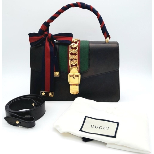 1152 - A Gucci Black Calfskin Sylvie Bag. Black calfskin leather exterior with gold-toned hardware, featuri... 