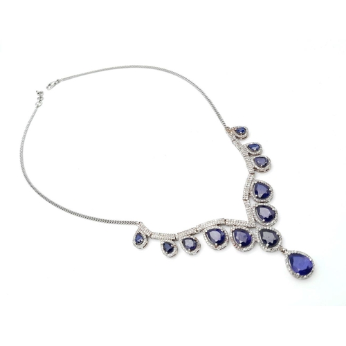 337 - A Blue Sapphire and Diamond Necklace. Set in 925 Silver. Pear shaped sapphires -20ctw approx with Di... 