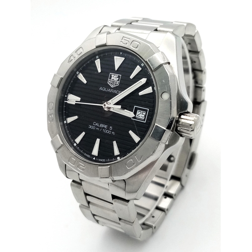 139 - A Tag Heuer Aquaracer Calibre 5 Automatic Gents Watch. Model - Way2110. Stainless steel bracelet and... 