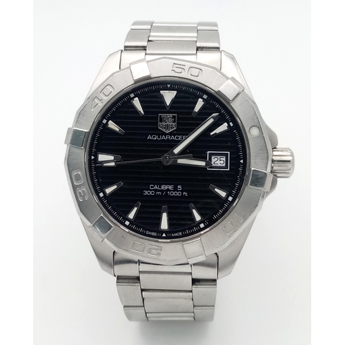 139 - A Tag Heuer Aquaracer Calibre 5 Automatic Gents Watch. Model - Way2110. Stainless steel bracelet and... 