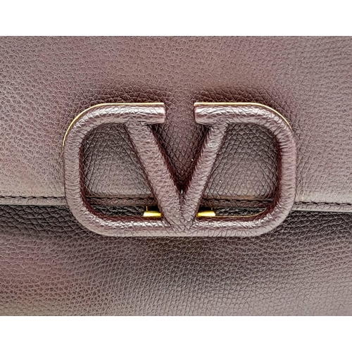 152 - A Valentino Garavani Burgundy Leather Shoulder Bag. Burgundy leather exterior with gold-toned hardwa... 