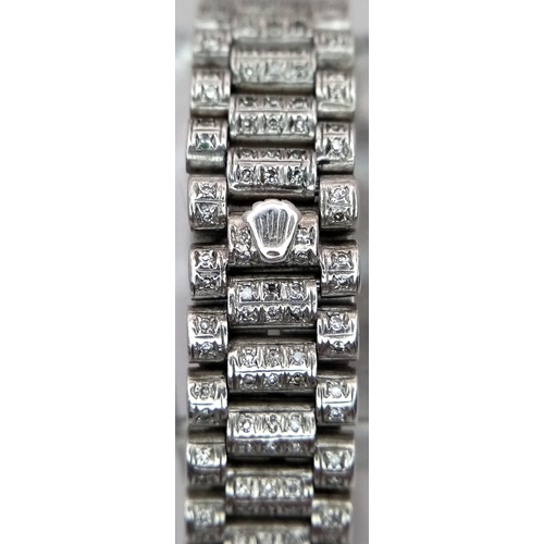 153 - An 18 K white gold, ladies ROLEX DATEJUST OYSTER PERPETUAL watch, covered with round cut diamonds th... 