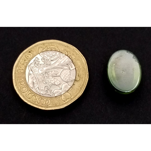 174 - An extremely rare, six-ray, GREEN STAR SAPPHIRE! The oval cabochon has a weight of 9.20 carats and d... 