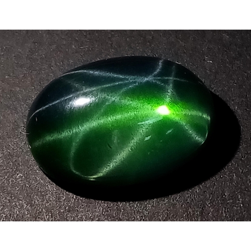 174 - An extremely rare, six-ray, GREEN STAR SAPPHIRE! The oval cabochon has a weight of 9.20 carats and d... 