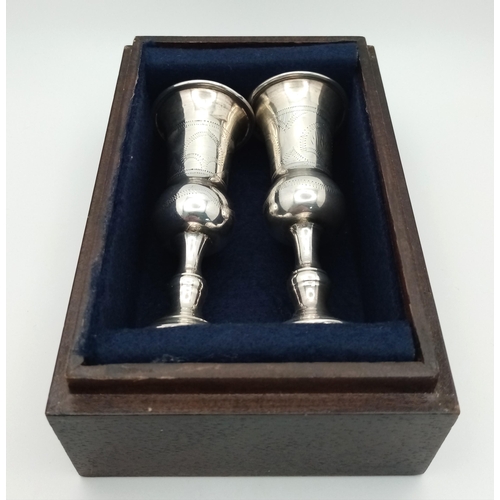 195 - An antique pair of KIDDUSH cups made by Moses Salkind – a leading silversmith of Judaica artefacts. ... 