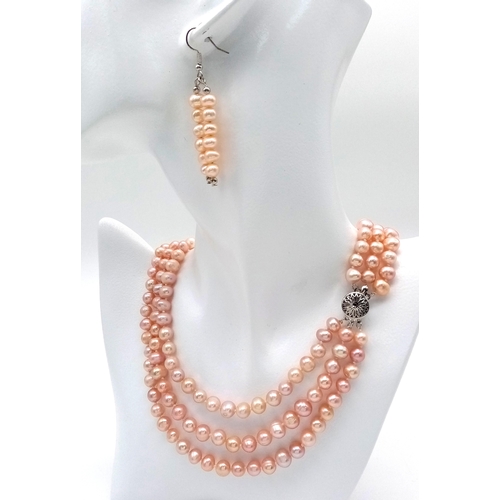 202 - A fashionable, vintage, three strand, high quality, natural pink pearls necklace, bracelet and earri... 