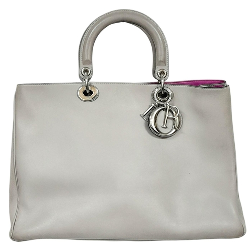 229 - A Christian Dior Grey Leather Diorissimo Tote Bag. Grey leather exterior with silver-toned hardware,... 