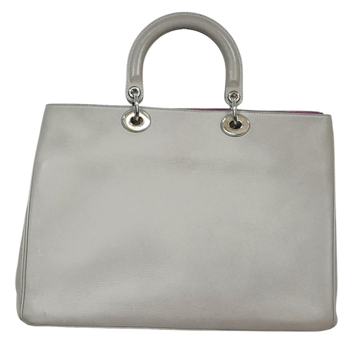 229 - A Christian Dior Grey Leather Diorissimo Tote Bag. Grey leather exterior with silver-toned hardware,... 