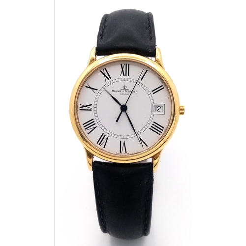 236 - An 18K Gold Cased Baume and Mercier Quartz Gents Watch. 
Black leather strap. 18k gold case - 34mm. ... 