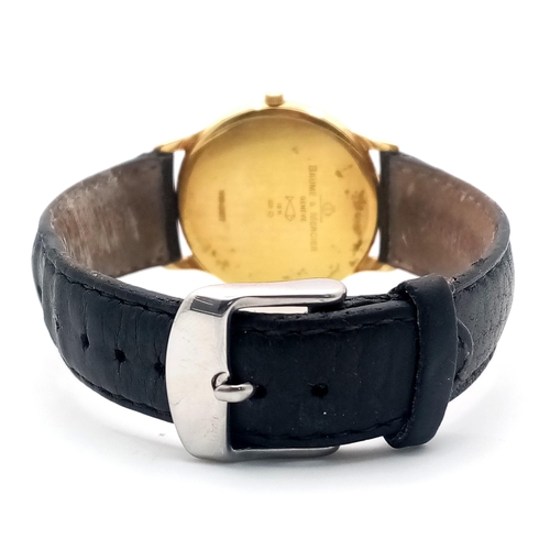 236 - An 18K Gold Cased Baume and Mercier Quartz Gents Watch. 
Black leather strap. 18k gold case - 34mm. ... 