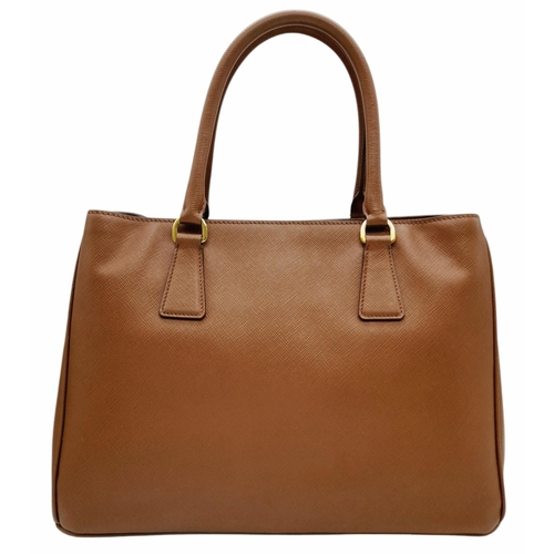 250 - A Prada Brown Saffiano Leather Double Tote Bag. Brown saffiano leather exterior with gold-toned hard... 