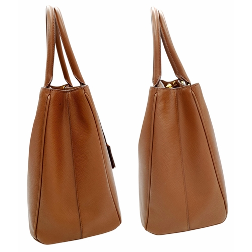 250 - A Prada Brown Saffiano Leather Double Tote Bag. Brown saffiano leather exterior with gold-toned hard... 