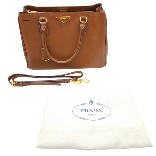 250 - A Prada Brown Saffiano Leather Double Tote Bag. Brown saffiano leather exterior with gold-toned hard... 