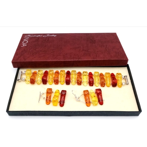 265 - An exciting multi-coloured resin bracelet and earrings set in a presentation case. Bracelet length: ... 