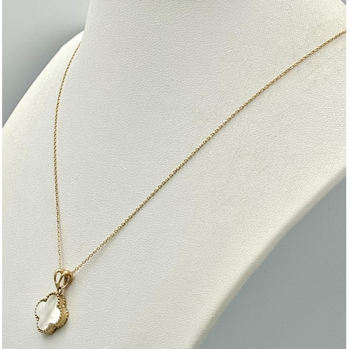 267 - An 18K Gold and  Mother of Pearl Pendant on an 18K Gold Disappearing Necklace. 2cm and 44cm. 2.95g