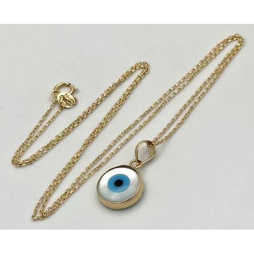 288 - An 18K Yellow Gold and Enamel Evil Eye Pendant on an 18K Yellow Gold Disappearing Necklace. 15mm and... 