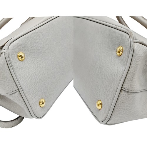 314 - A Prada Grey Saffiano Leather Double Tote Bag. Grey saffiano leather exterior with gold-toned hardwa... 