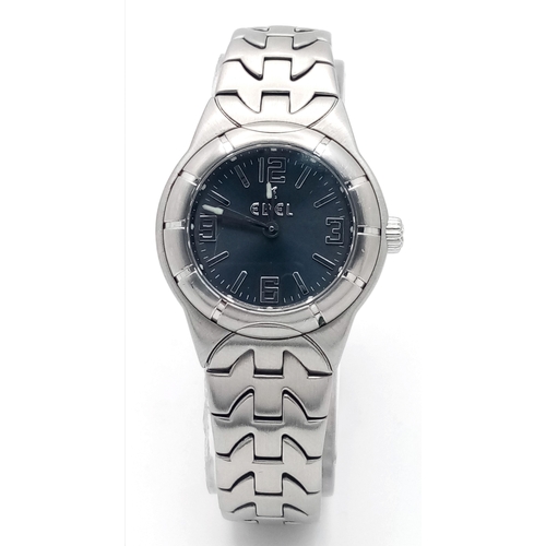 335 - An Ebel Type E Quartz Ladies Watch. Stainless steel bracelet and case - 26mm. Dark grey dial. In wor... 