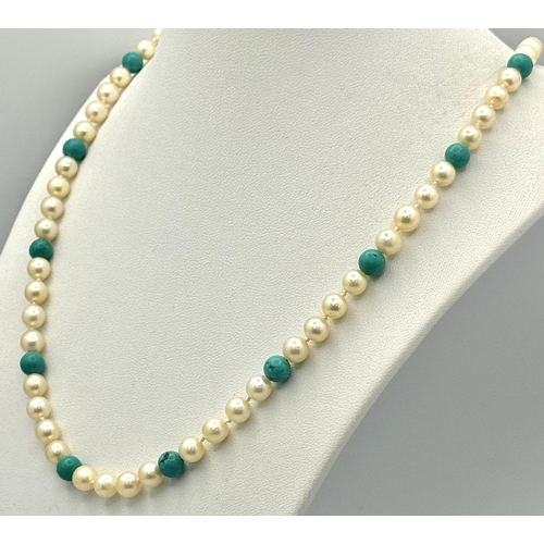 344 - A Turquoise and Cultured Pearl Beaded Necklace. Gold filled and 9k clasp. 44cm