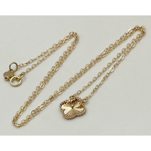 358 - An 18K Gold Attached Clover Pendant on an 18K Gold Disappearing Necklace. 12mm and 42cm. 2.7g