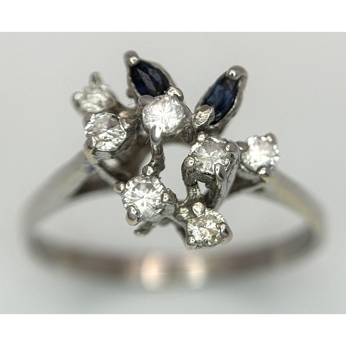 372 - A Vintage 18K White Gold, Diamond and Sapphire Floral Burst Ring. Size N. 2.6g