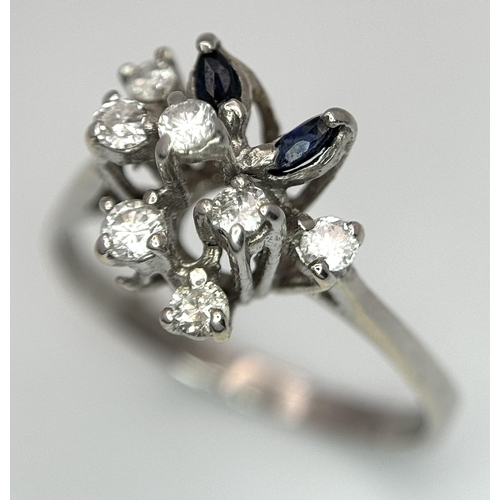 372 - A Vintage 18K White Gold, Diamond and Sapphire Floral Burst Ring. Size N. 2.6g