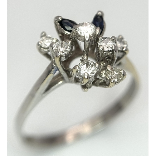 372 - A Vintage 18K White Gold, Diamond and Sapphire Floral Burst Ring. Size N. 2.6g