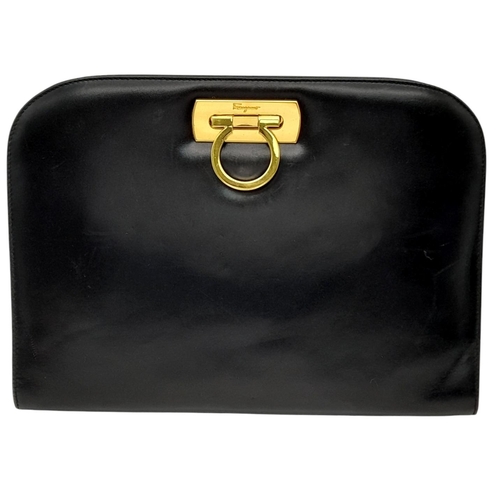 440 - A Salvatore Ferragamo Black Leather Shoulder Bag. Black leather exterior with gold-toned hardware, c... 