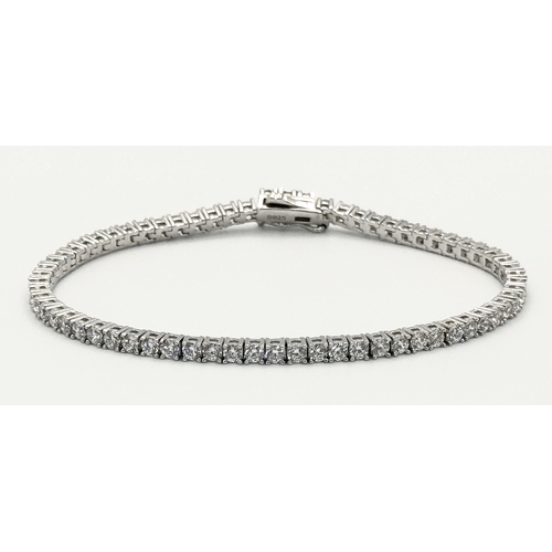 533 - A 925 Silver and White Stone Tennis Bracelet. 18cm