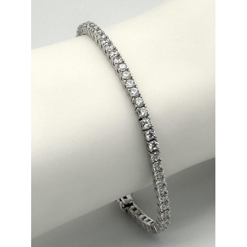 533 - A 925 Silver and White Stone Tennis Bracelet. 18cm