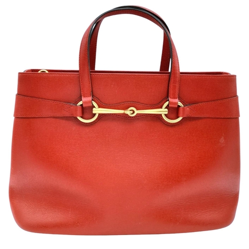 545 - A Gucci Red Leather Horsebit Top Handle Bag. Red leather exterior with gold-toned hardware and dual ... 